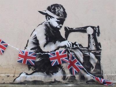 Mural "Pracujący niewolnik" wykrojony przez nieznanych sprawców ze ściany w Londynie został sprzedany na aukcji w czerwcu 2013 r. za 1,1 mln USD (FOT. banksy)
