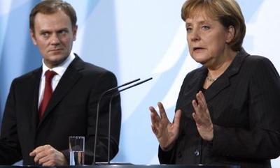Donald Tusk i Angela Merkel, fot.: Bloomberg